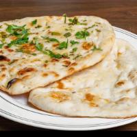 Garlic Naan · Vegetarian. White flour bread garnished with minced garlic and cilantro.