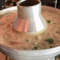 Tom Kha Soup · Coconut soup seasoned with galangal, lime juice, mushroom, scallions and parsley.