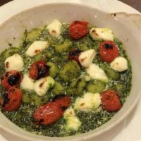 Gnocchi · potato dumpling, tuscan kale sauce, cherry tomato confit, fresh mozzarella, pecorino