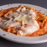 Baked Ziti · Ziti mixed with sauce and ricotta cheese topped with mozzarella cheese.