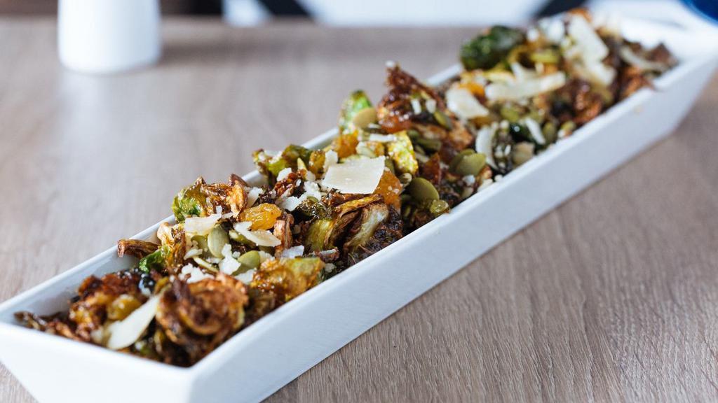 Crispy Brussels Sprouts · Bacon, roasted pepitas, sun dried cranberries, apple cider vinaigrette