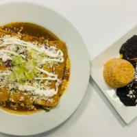 Enchiladas · Chicken or beef topped with lettuce, pico de gallo, queso fresco, sour cream, Spanish rice a...
