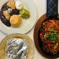 Fajitas · Chicken, beef or shrimp on cast iron skillet with bell peppers, onions, shredded cheese, pic...
