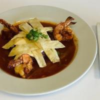 Mar Y Tierra · Tender filet mignon grilled to perfection with jumbo shrimp tossed in spicy chorizo sauce, m...