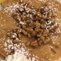 Pancakes · Served with butter and powdered sugar. Three pancakes served with butter, whipped cream, and...