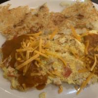 Southwest Omelet · Grilles chicken, green pepper, onion, tomatoes, and cheddar cheese, topped with salsa. Serve...