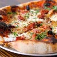 Salsiccia Pizza · tomato, Italian sausage, squash blossoms, fennel, ricotta, chili