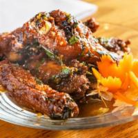 Basil Wings · Deep-fried chicken wings with our basil sauce.