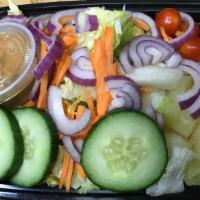 Garden Salad · Fresh lettuce, cucumber, carrots, onions, tomatoes, and pineapple chunks served with peanut ...