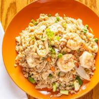 House Fried Rice · Fried rice with chicken, shrimps, egg, onions, and peas with Thai seasoning.