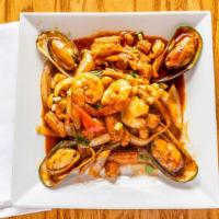 Seafood Prik-Pow · Sautéed scallops, shrimps, squid, and mussels in prik-pow chili sauce with onions, mushrooms...