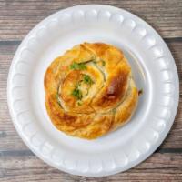 Spanakopita · Phyllo pastry filled with spinach, feta cheese, scallions, and Greek seasonings.