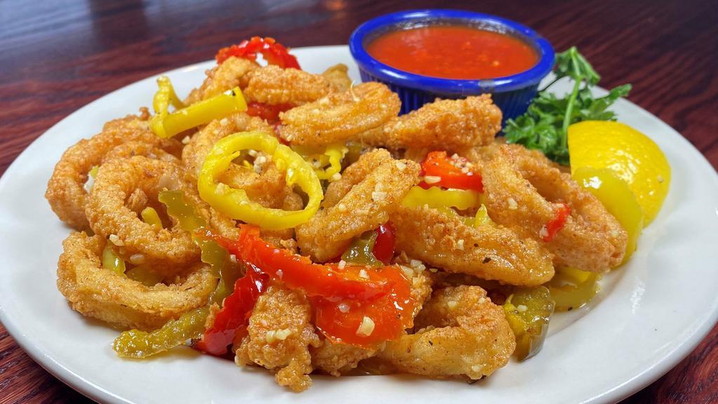 Fried Calamari · FRIED or RHODE ISLAND Style. Served with a side of marinara sauce.
Rhode Island Style (pictured) is sauteed with spicy cherry peppers