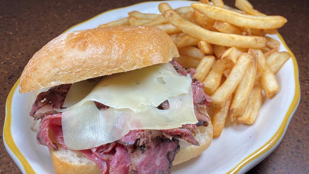 Grilled Pastrami Sandwich · black pastrami topped with melted swiss on a grilled ciabatta roll