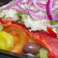Greek Salad - Fm Style · Iceberg and romaine lettuce, red onions, vine ripe tomatoes, cucumbers, red & green peppers,...