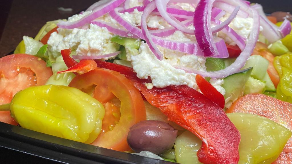 Greek Salad - Fm Style · Iceberg and romaine lettuce, red onions, vine ripe tomatoes, cucumbers, red & green peppers, pepperoncinis, feta cheese, kalamata olives and your choice of dressing