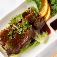 Beef Aspara-Gyu · Thin slices of beef rolled with asparagus, grilled and topped with teriyaki sauce.