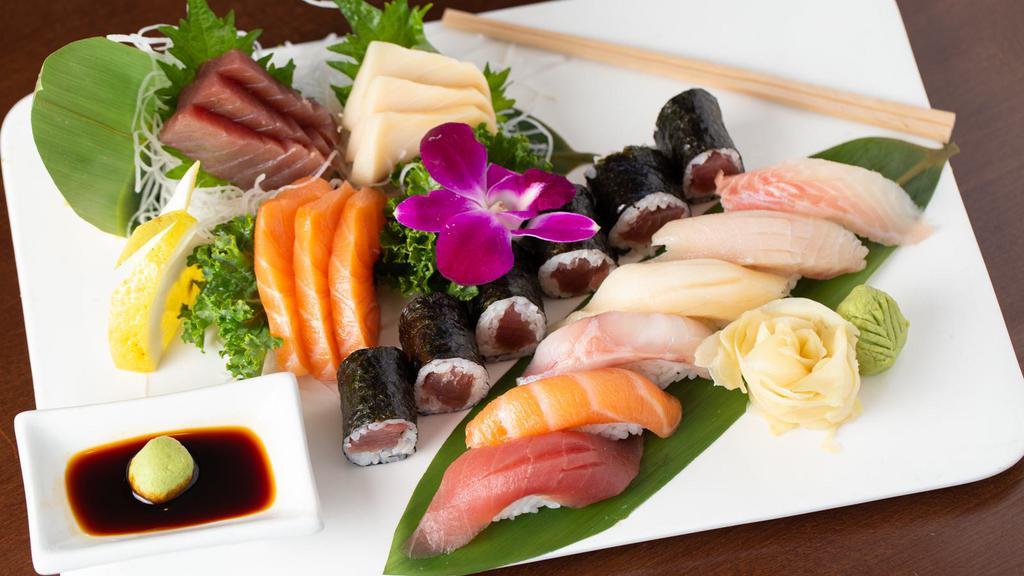 Sushi & Sashimi Combo · Six pieces nigiri sushi, eight sashimi and Tuna roll.