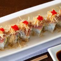 Wellesley Roll · White tuna avocado roll topped with torched tuna, tobiko, scallions, crispy taro flakes and ...