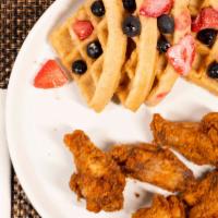 Chicken & Waffle · Flavors (red velvet.French toast, half/half). topped with mix berries whip & caramel glaze.