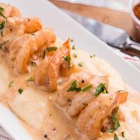 Shrimp & Grits · Creamy Cheddar grits with cajun cream shrimp.