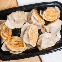 Japanese Gyoza · Six pieces. Meat and vegetable dumpling served steamed or pan-fried.