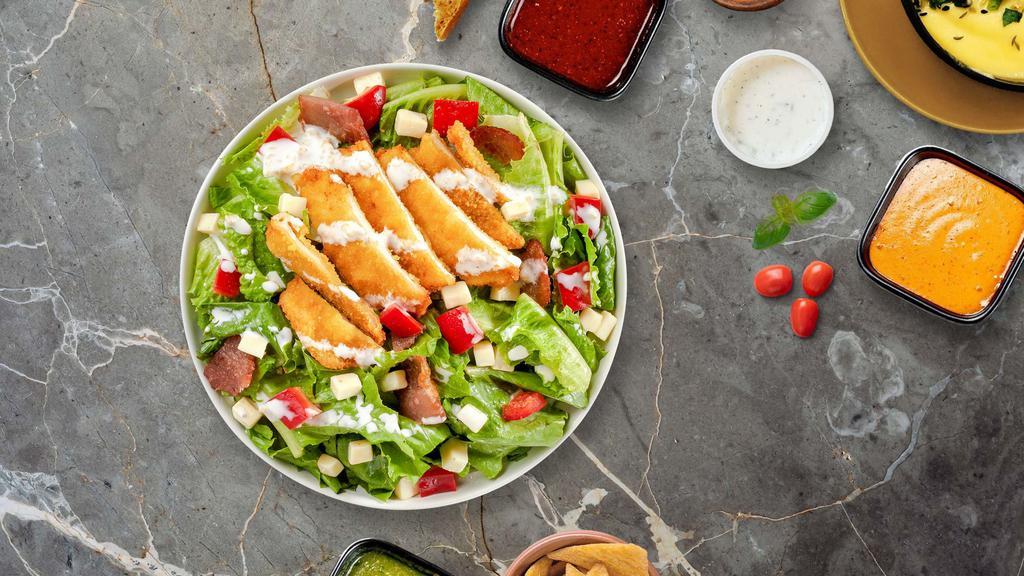 Crunch O'Cluck Salad · Fresh iceberg lettuce, tomatoes, onion, green peppers, black and green olives and cheese with crispy chicken chunks. Topped with parmesan cheese.