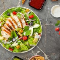 Thrill Of The Grill Chicken Salad · Fresh iceberg lettuce, tomatoes, onion, green peppers, black and green olives and cheese wit...