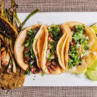 Tacos Don Barriga · 3 tacos with choice of meat and side of grilled cactus, jalapeno pepper and scallions. Choic...