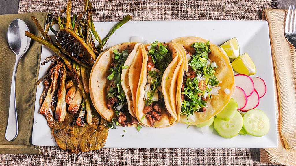 Tacos Don Barriga · 3 tacos with choice of meat and side of grilled cactus, jalapeno pepper and scallions. Choice of the meat steak,chicken,ground beef,tripe,tounge,Angus beef,pastor,carnitas,vegetarian,shrimp.