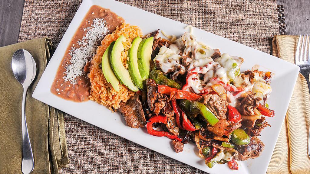 Steak Alambre · Cooked with bacon, green and red bell peppers, onions, riched with melted mozzarella cheese, served with rice, beans and avocado.