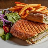 Turkey Pesto Panini · All paninis served on thick Italian bread with a small serving of our house salad and french...