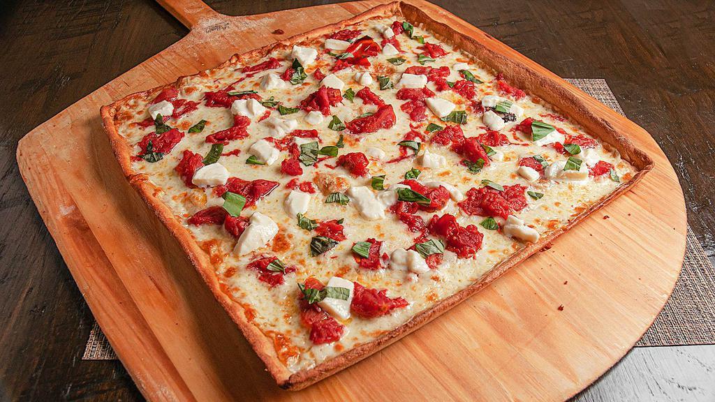 Margherita Pizza (Large) · Italian tomatoes, basil leaf, olive oil, fresh mozzarella and mozzarella.