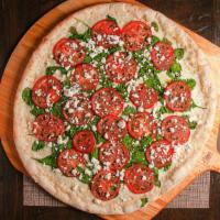 White Feta · Fresh tomatoes, spinach, garlic, olive oil, feta & mozzarella.