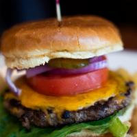 Cheeseburger · 6 ounces beef patty. cheddar, lettuce, red onions, tomatoes, pickles and mayo in brioche bun.