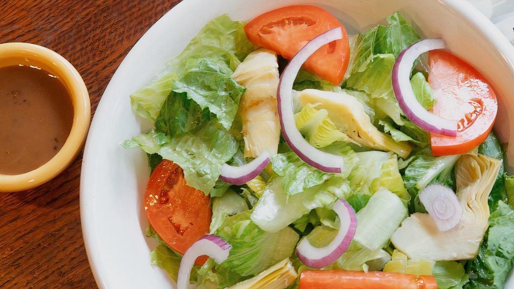 Angelico Salad · Romaine, artichokes, tomatoes and red onions with balsamic dressing.