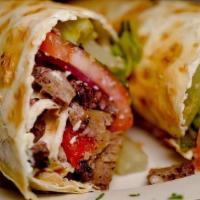 Roasted Lamb Roll · Roasted lamb, tomatoes, red onions, roasted red peppers, feta & yogurt dressing rolled with ...