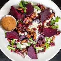 Roast Beet Salad · Greens, roasted beets, feta cheese, dried cranberries, candied walnuts.