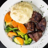 Steak Tip Dinner · Marinated steak tips, mashed potatoes, veggies.