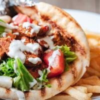 Chicken Gyro Combo · Grilled chicken gyro on pita bread, Chicken seared over charcoal grille topped with Green Le...