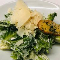 Caesar Salad · Romaine lettuce, parmigiano, homemade crostini, and caesar dressing.