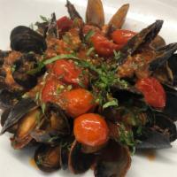 Mussels · Sautéed mussels, cherry tomato, white wine, crushed red pepper, and EVOO.