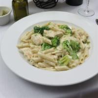 Chicken Alfredo · Sautéed chicken breast, penne pasta with broccoli, Alfredo sauce