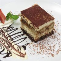 Tiramisu · Layers of espresso drenched sponge cake and mascarpone cheese dusted with cocoa powder