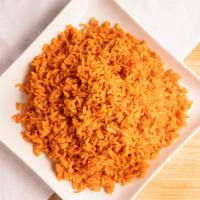 Jollof Rice · One-pot of rice cooked in a flavored tomato and pepper purée.