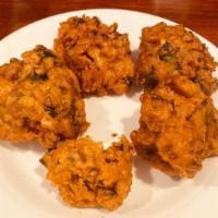Vegetable Pakora · Fresh vegetable fritters of spinach, potato, green pepper, and onion.