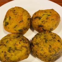 Saag Tikki · Mashed potatoes patties minced with spinach, onions, fresh ginger and cumin.