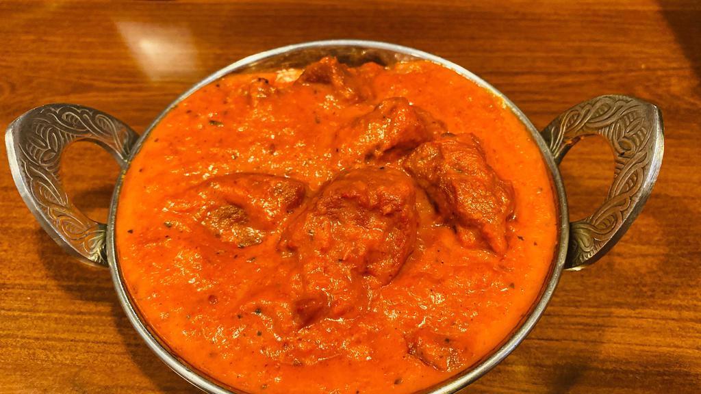Lamb Masala · Pieces of lamb cooked in a mildly spiced tomato sauce and herbs.