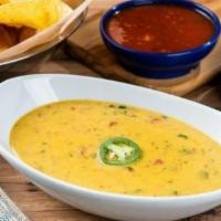 Border Queso · Our signature queso mixed with our salsa verde for an extra kick.
