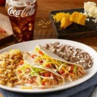 Classic Beef Soft Taco · Chicken tinga, pico de gallo and cheese rolled in a flour tortilla smothered with chile con ...